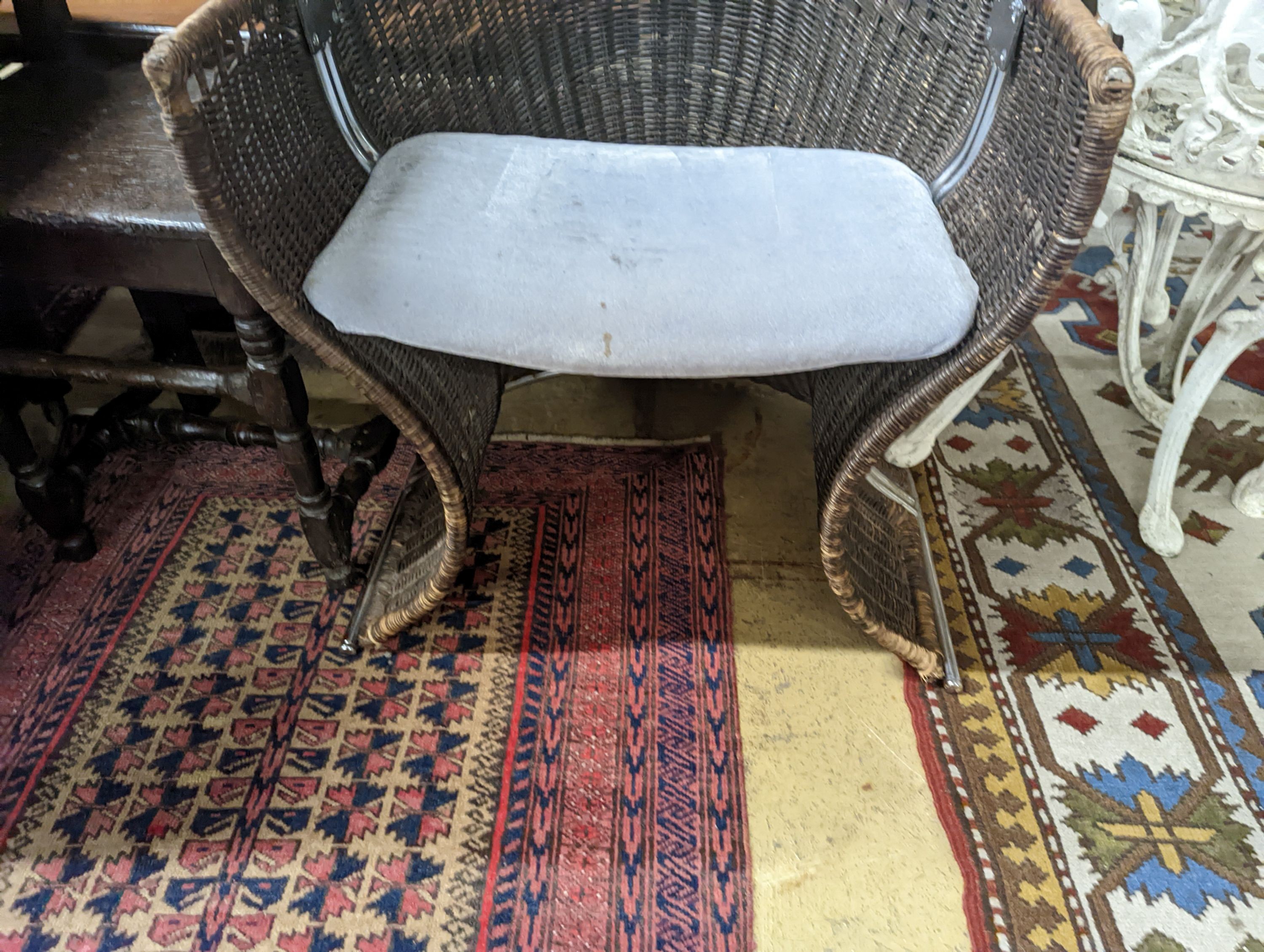 A rattan and chrome conservatory chair, width 60cm, depth 50cm, height 73cm